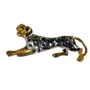 Gold-tone and silver-tone spotted cheetah brooch/pin.